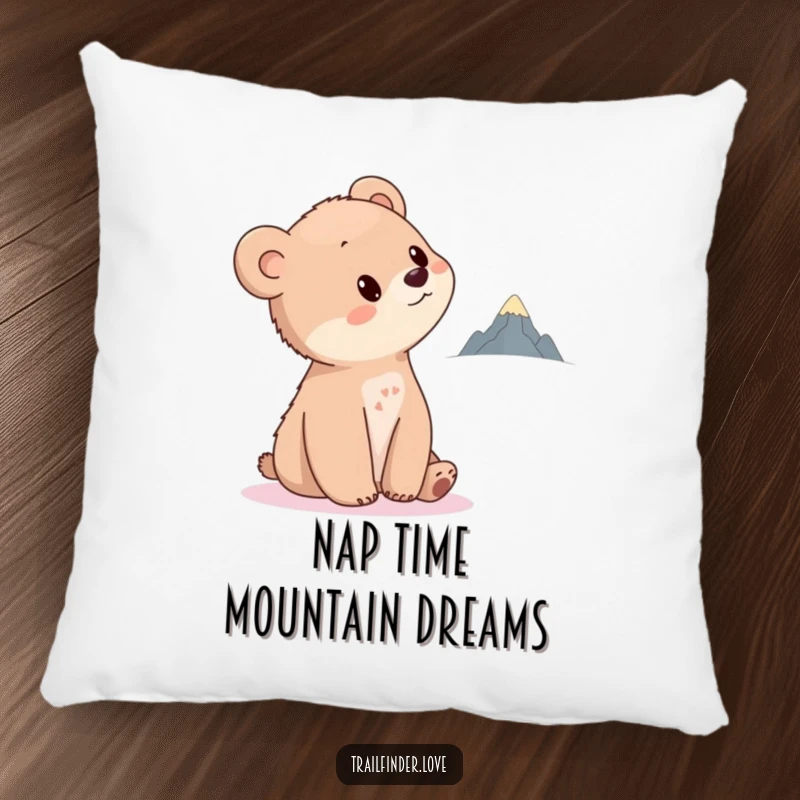 Funny Bear Cub Pillow with a cute cub tilting its head towards a distant, tiny mountain, offering cozy comfort and a touch of inspiration.